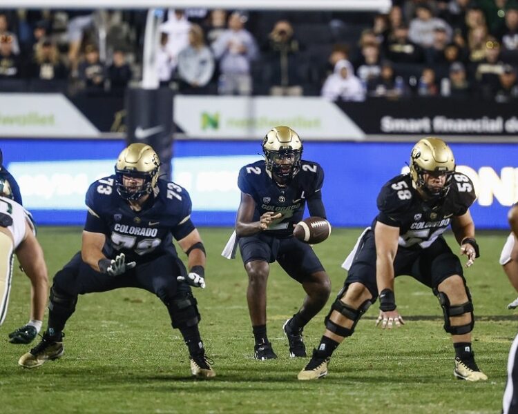 September 16, 2023: Colorado Buffaloes quarterback Shedeur Sanders (2) takes the snap as Colorado Buffaloes center Hank Zilinskas (58) and Colorado Buffaloes guard Landon Bebee (73) get set to block in the second half of the football game between Colorado and Colorado State in Boulder, CO. Colorado rallied late from 11 down to win in double OT, 43-35. Derek Regensburger/CSM. (Credit Image: © Derek Regensburger/Cal Sport Media) (Cal Sport Media via AP Images)